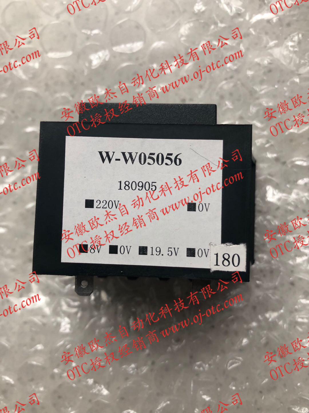 OTC DAIHEN W-W05056 auxiliary transformer side view with label